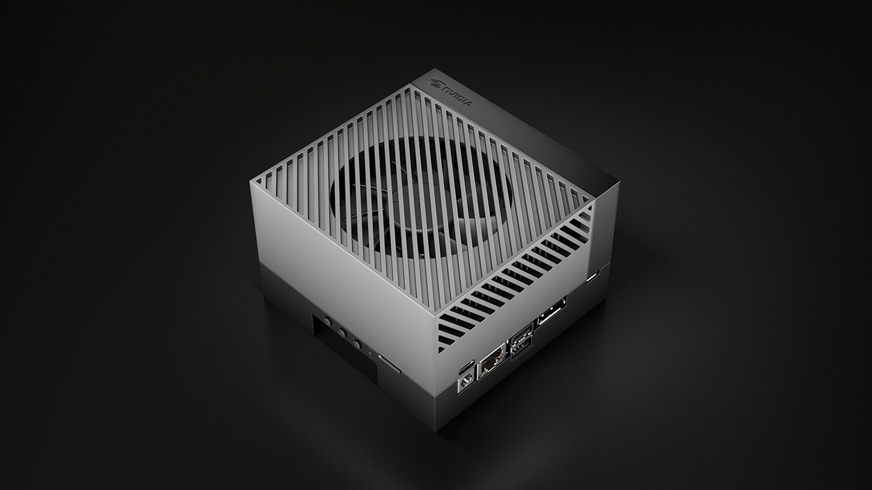 An NVIDIA Jetson AGX Orin developer kit with a slotted aluminium heatsink on a dark surface